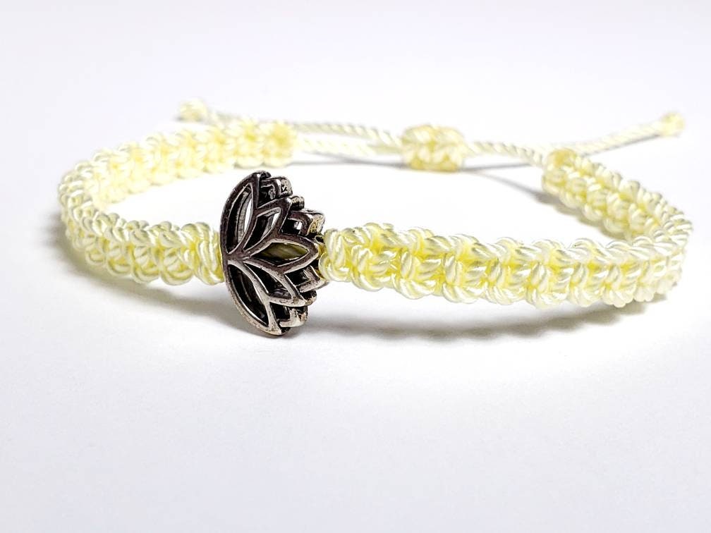 Lotus flower bracelet, soft yellow string braided bracelet, silver color lotus flower charm, new, adjustable for man & woman