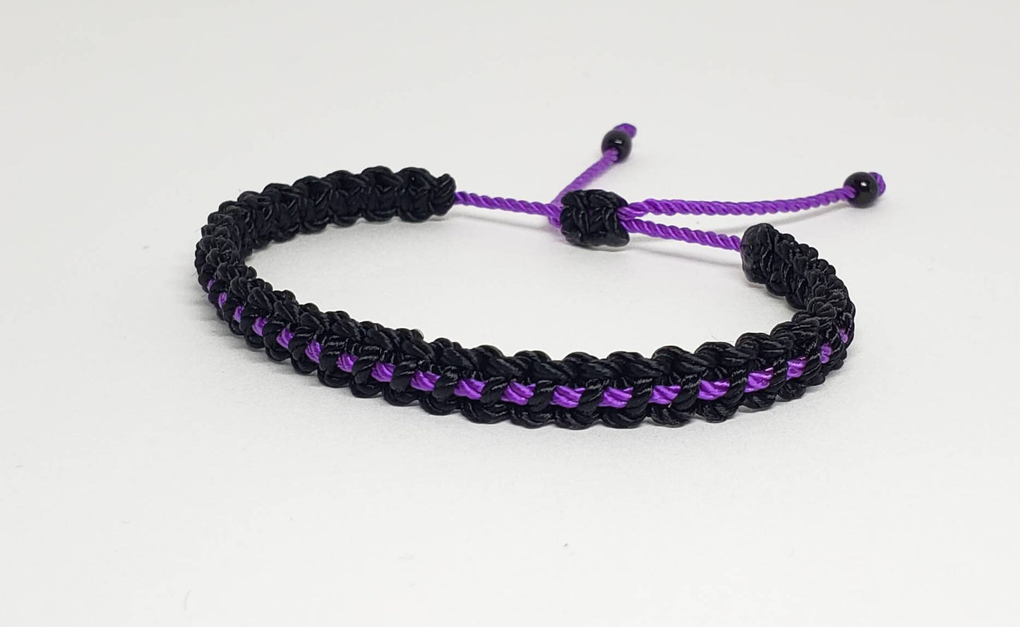 Thin purple line bracelet, black braided bracelet with a thin purple line, adjustable wristband for man & woman