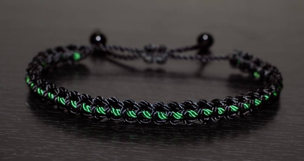 Black braided bracelet with a  green Line, adjustable wristband -new -handmade -for man & woman