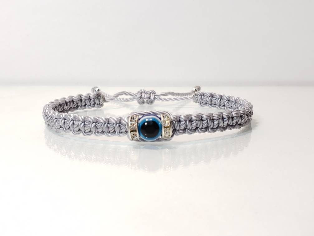 evil eye bracelet, evil eye protection amulet, silver braided bracelet, brand new, adjustable.