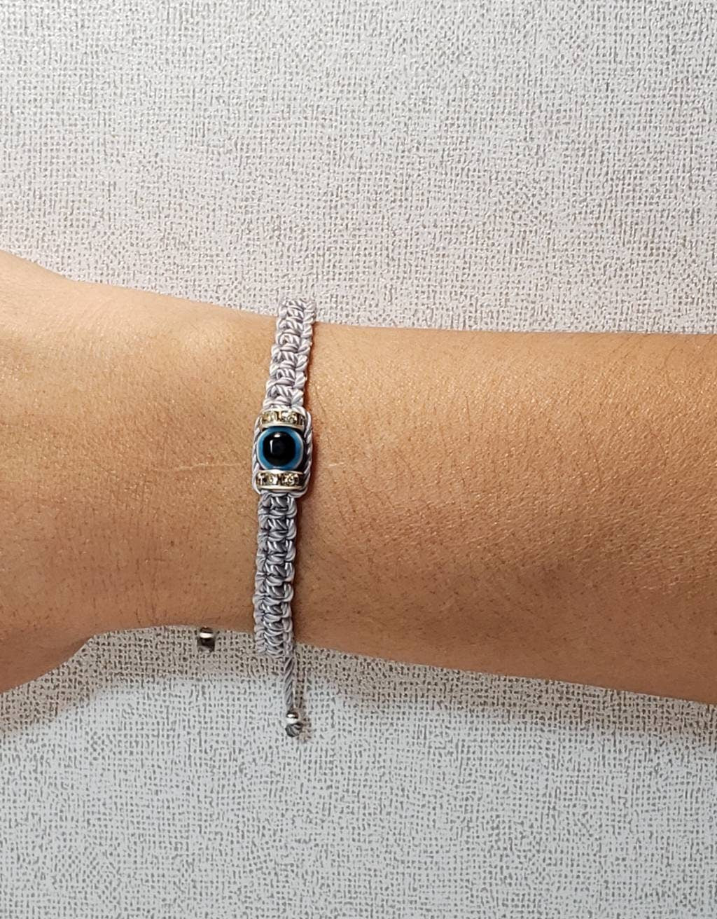 evil eye bracelet, evil eye protection amulet, silver braided bracelet, brand new, adjustable.