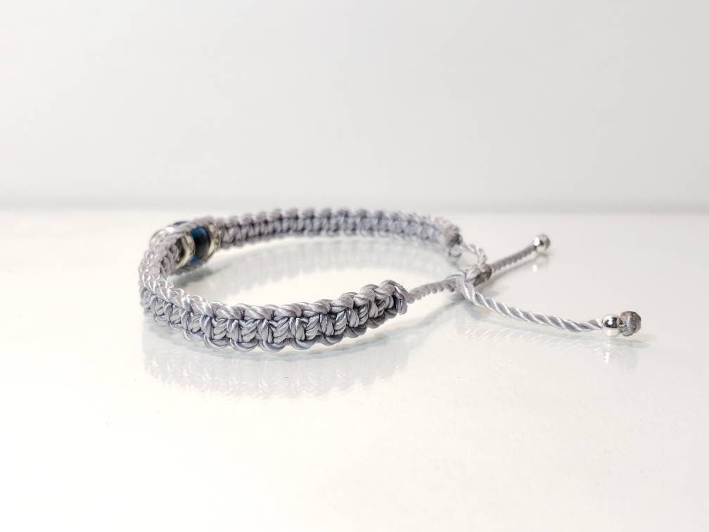 evil eye bracelet, evil eye protection amulet, silver braided bracelet, brand new, adjustable.