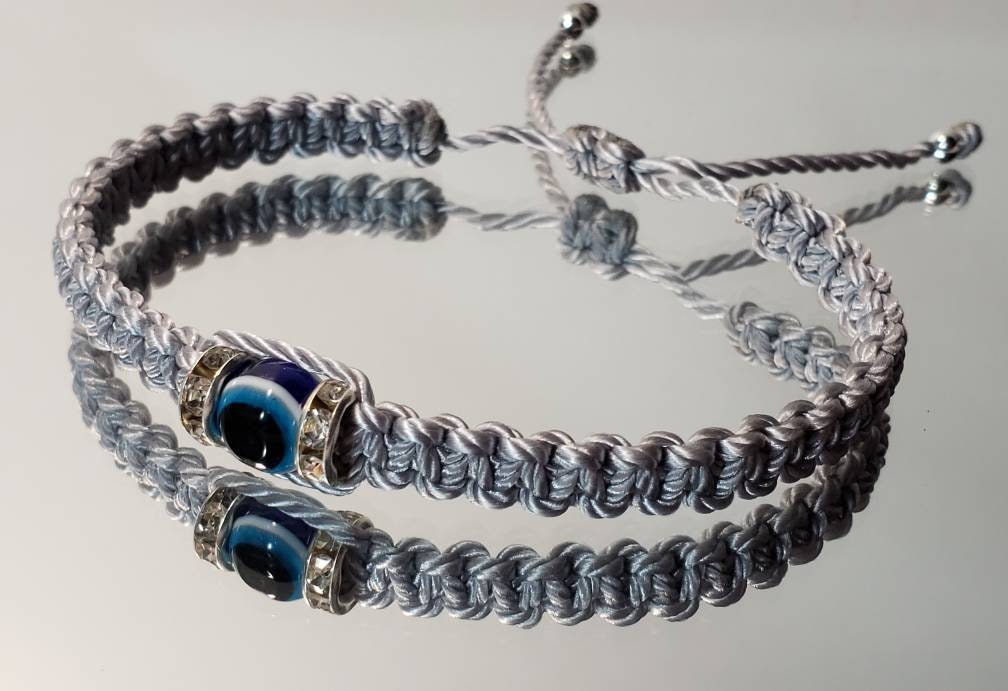 evil eye bracelet, evil eye protection amulet, silver braided bracelet, brand new, adjustable.