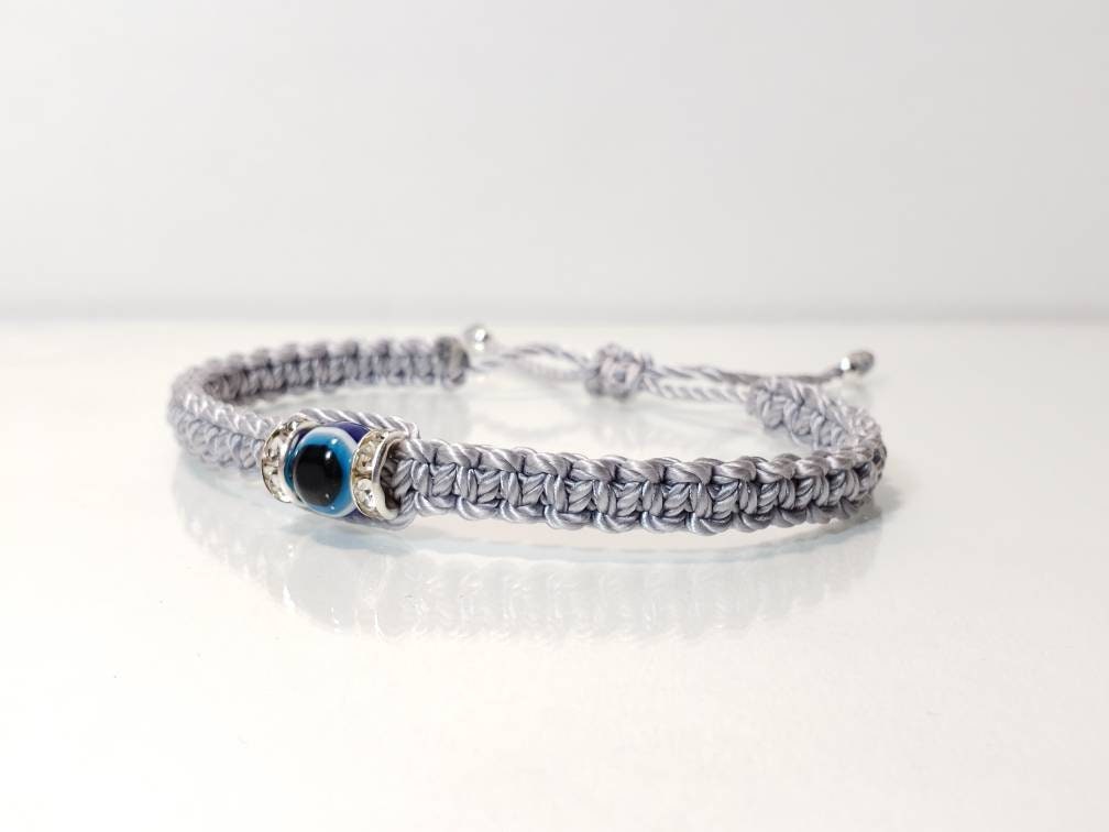 evil eye bracelet, evil eye protection amulet, silver braided bracelet, brand new, adjustable.