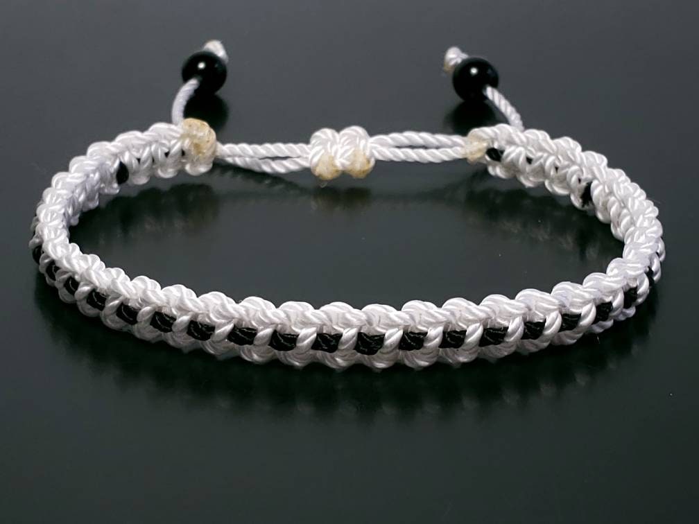 White with a black line bracelet -support wristband -braided -new -adjustable for man and woman