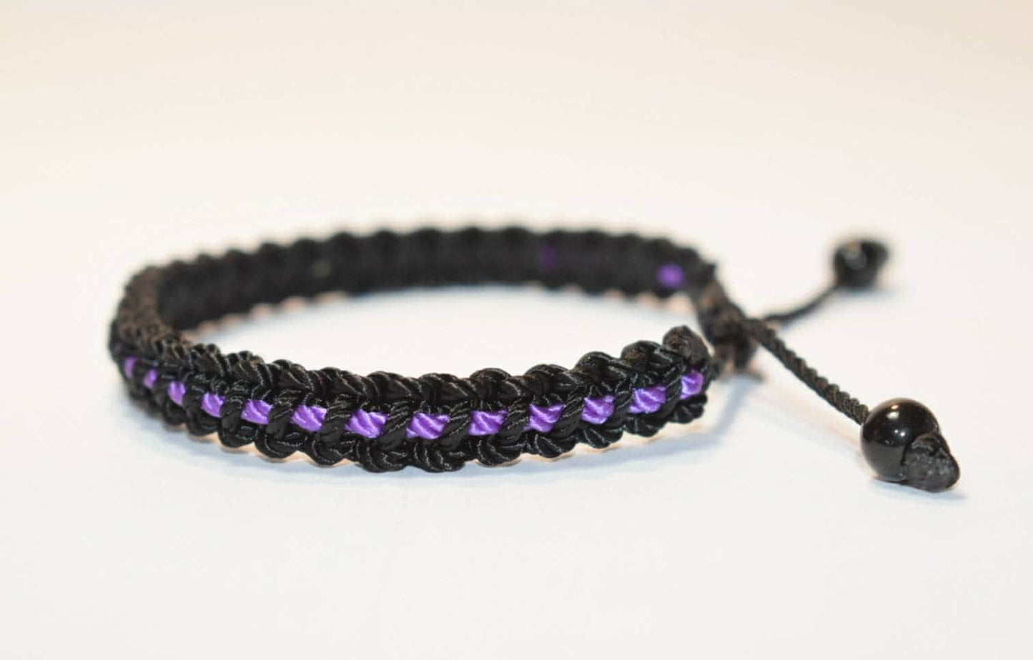 Thin purple line bracelet -Black braided bracelet with a purple Line, adjustable wristband -new- domestic violence awareness bracelet