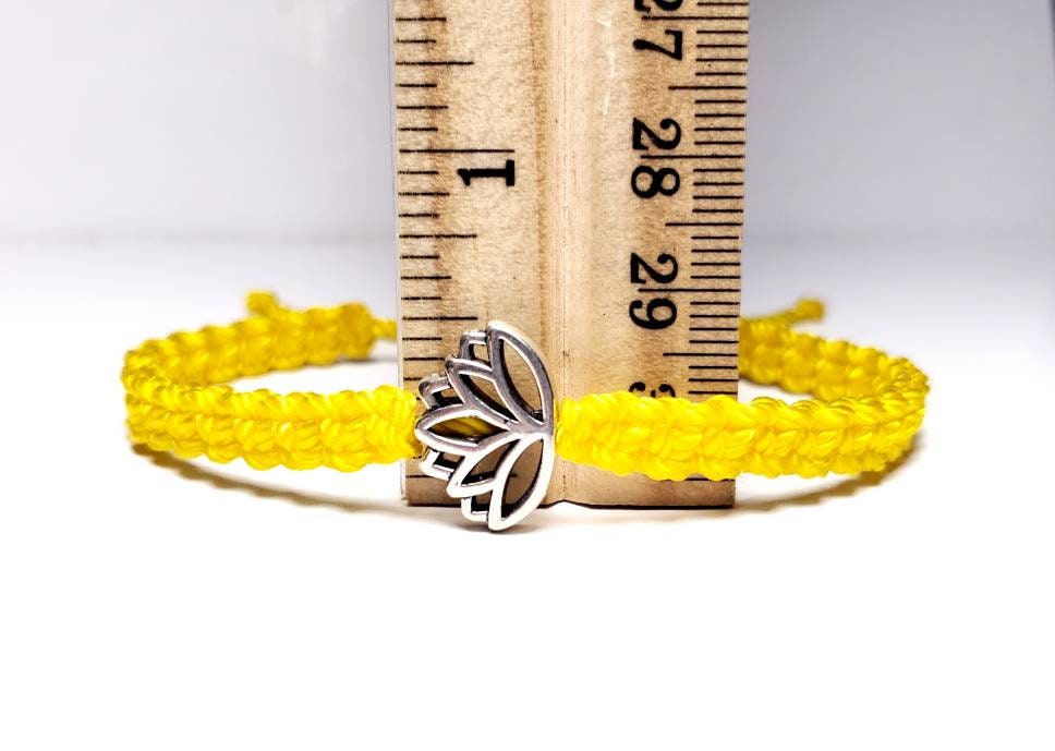 Lotus flower bracelet, yellow string braided bracelet, silver color lotus flower charm, new, adjustable for man & woman