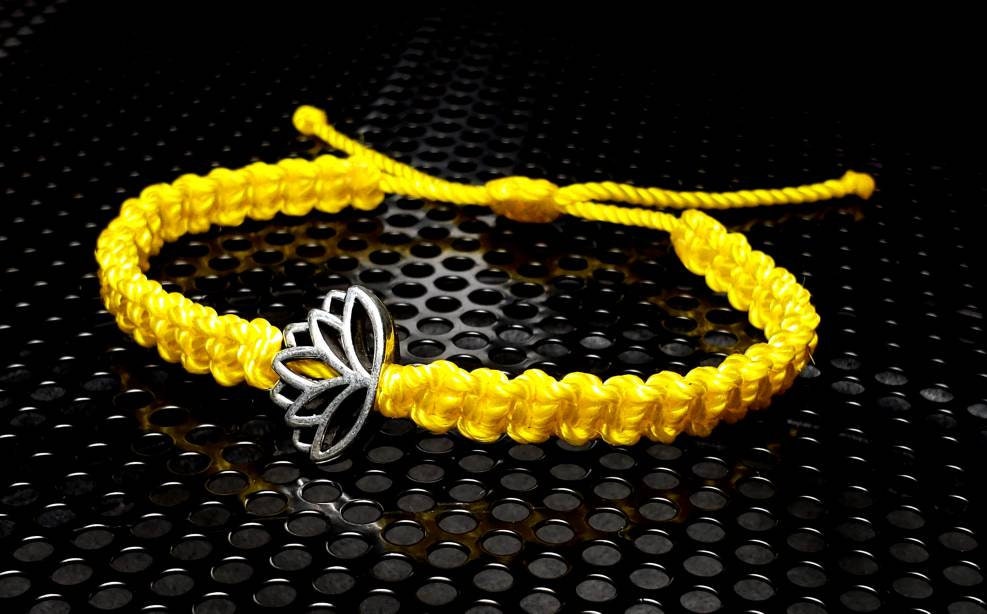 Lotus flower bracelet, yellow string braided bracelet, silver color lotus flower charm, new, adjustable for man & woman