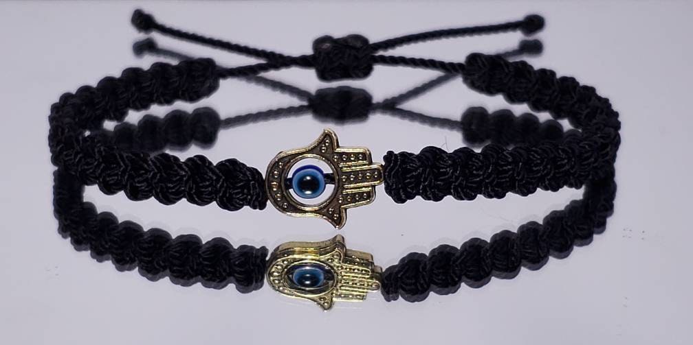 Hamsa hand bracelet with an evil eye for protection & good luck, braided black string wristband with a gold color hamsa hand adjustable