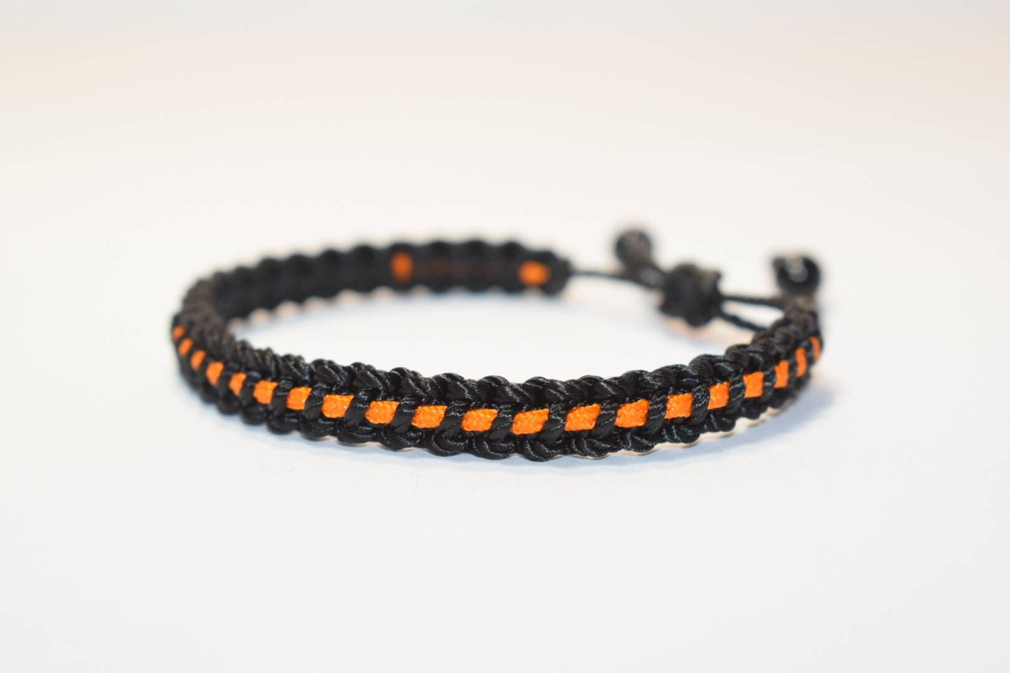 Black with orange line bracelet -Black braided bracelet with a  thin orange Line, adjustable wristband -new -handmade awareness  bracelet