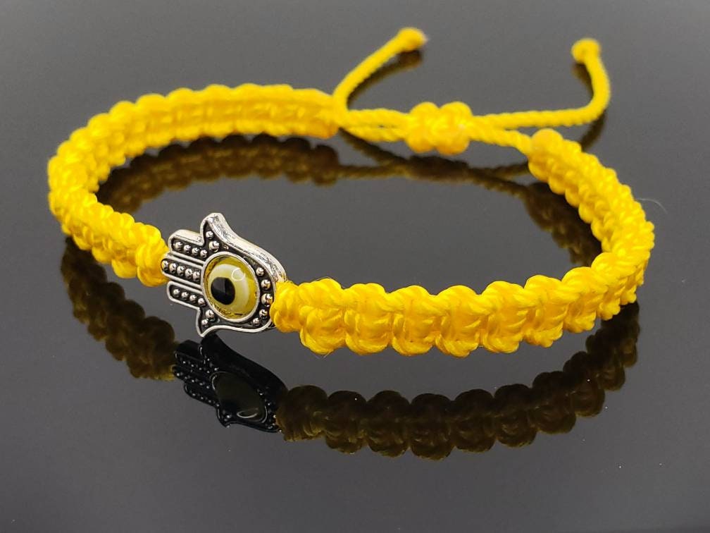 Hamsa Hand yellow bracelet with an evil eye for protection and good luck braided yellow string wristband with a silver color hamsa hand