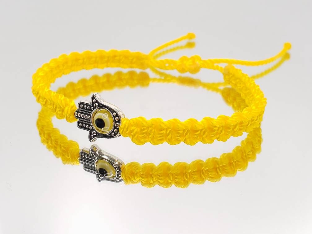 Hamsa Hand yellow bracelet with an evil eye for protection and good luck braided yellow string wristband with a silver color hamsa hand