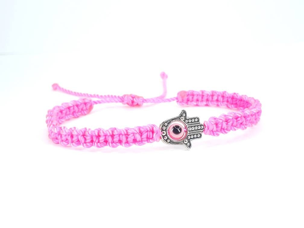 Hamsa Hand neon pink bracelet with an evil eye for protection & good luck braided neon pink string wristband with a silver color hamsa hand