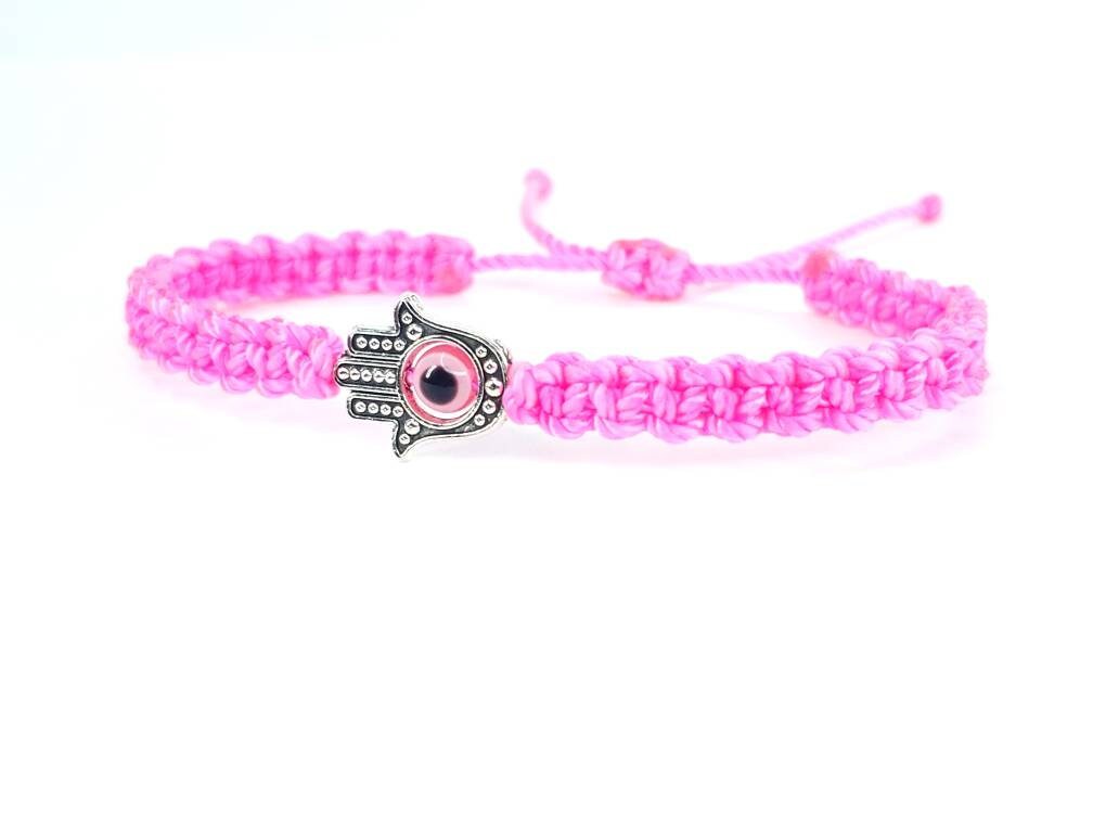 Hamsa Hand neon pink bracelet with an evil eye for protection & good luck braided neon pink string wristband with a silver color hamsa hand