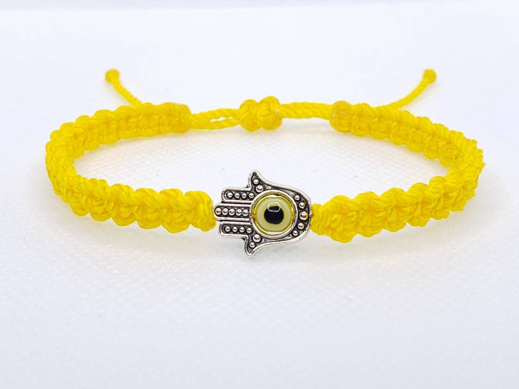 Hamsa Hand yellow bracelet with an evil eye for protection and good luck braided yellow string wristband with a silver color hamsa hand