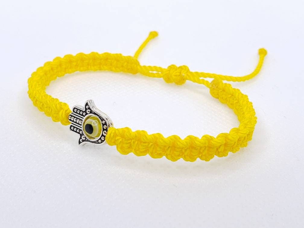 Hamsa Hand yellow bracelet with an evil eye for protection and good luck braided yellow string wristband with a silver color hamsa hand