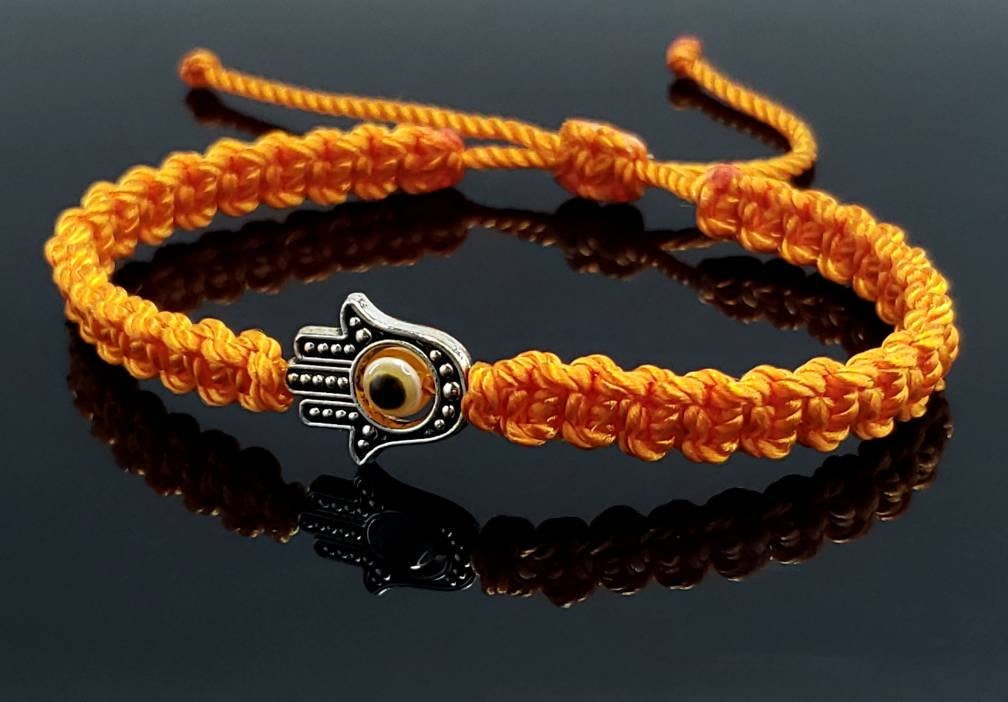 Hamsa Hand orange bracelet with an evil eye for protection and good luck, braided orange string wristband with a silver color hamsa hand