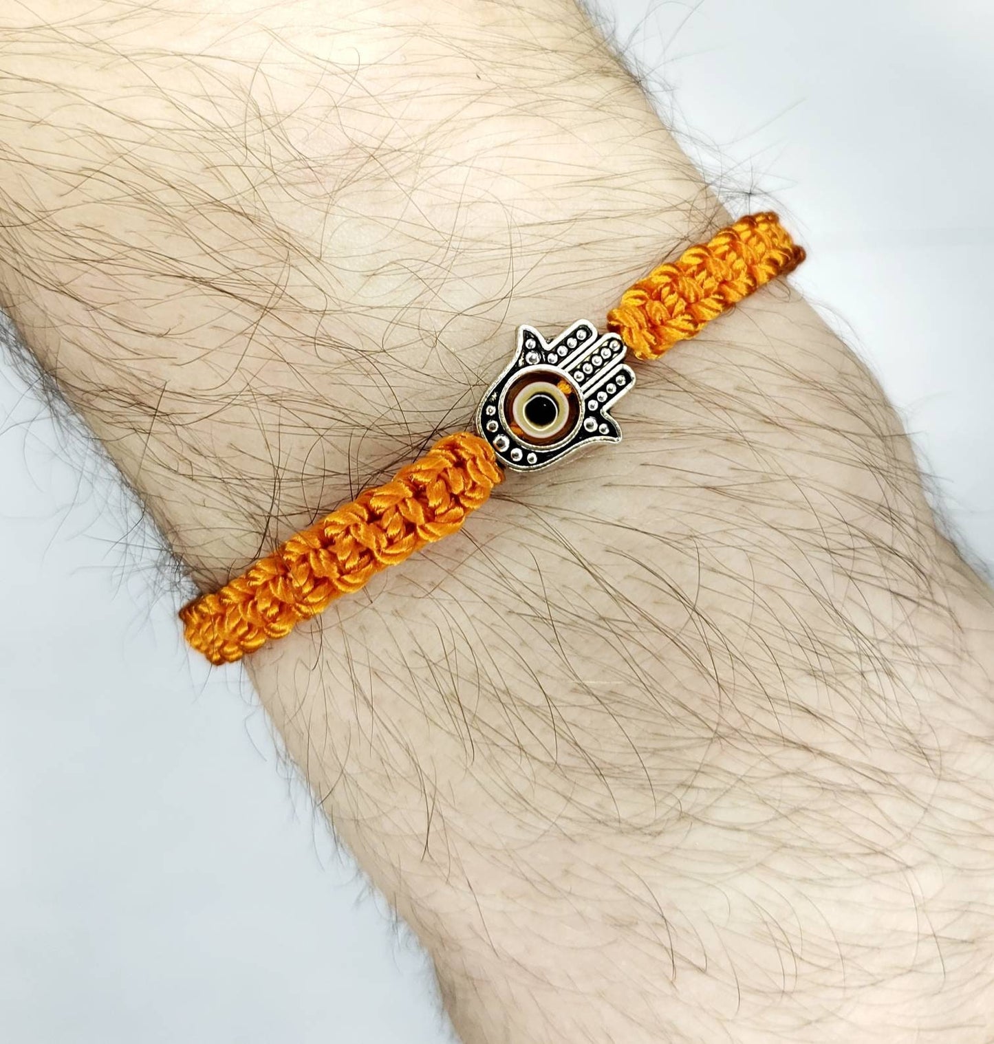 Hamsa Hand orange bracelet with an evil eye for protection and good luck, braided orange string wristband with a silver color hamsa hand