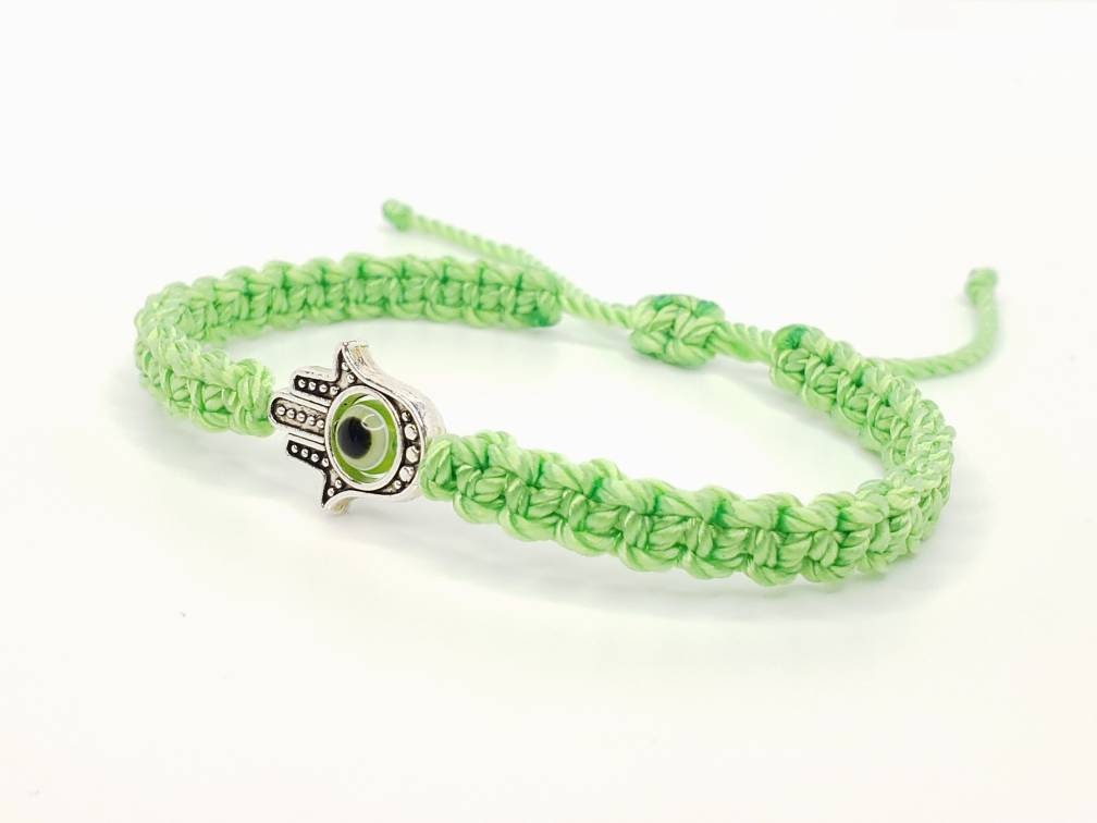 Hamsa Hand lime green bracelet with an evil eye for protection & good luck braided green string wristband with a silver color hamsa hand