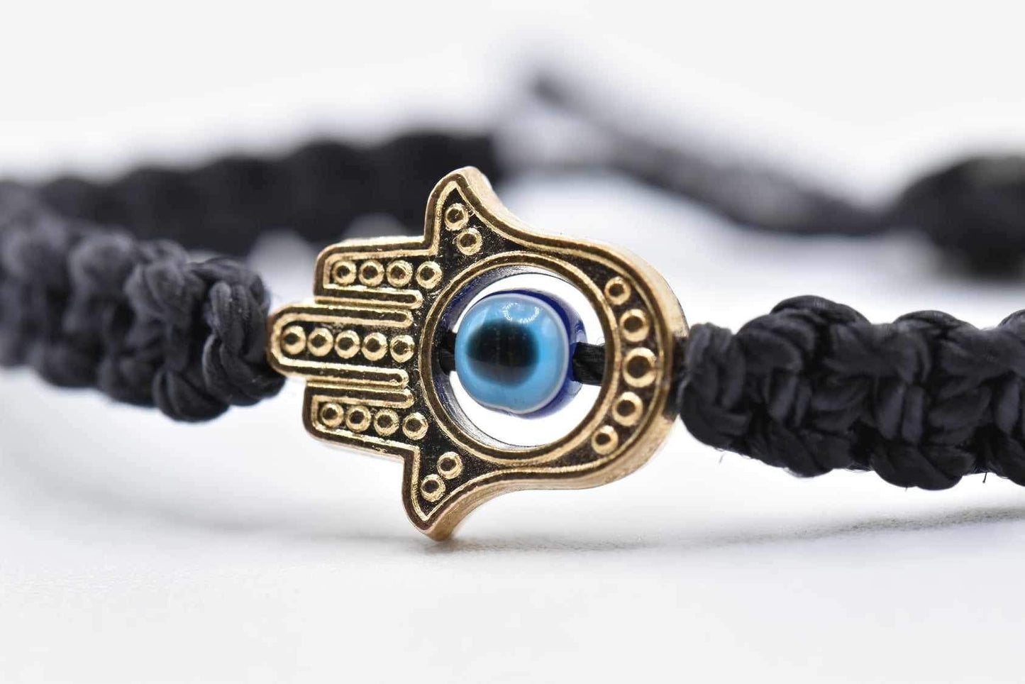 Hamsa hand bracelet with an evil eye for protection & good luck, braided black string wristband with a gold color hamsa hand adjustable