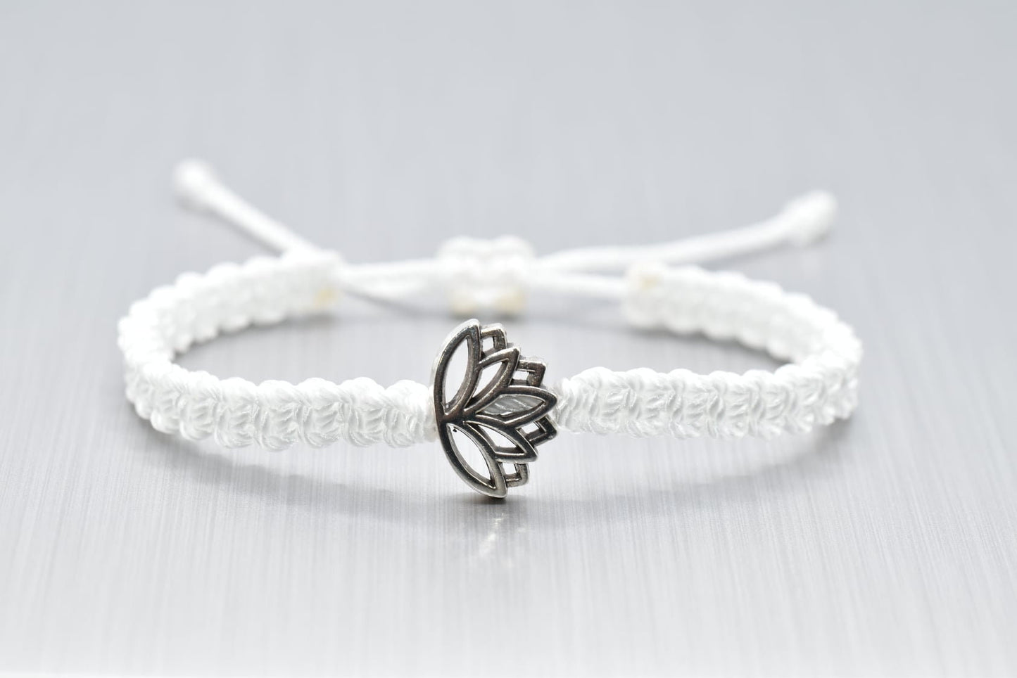 Lotus flower bracelet, white string braided bracelet silver color lotus flower charm, new, white lotus wristband,adjustable for man & woman